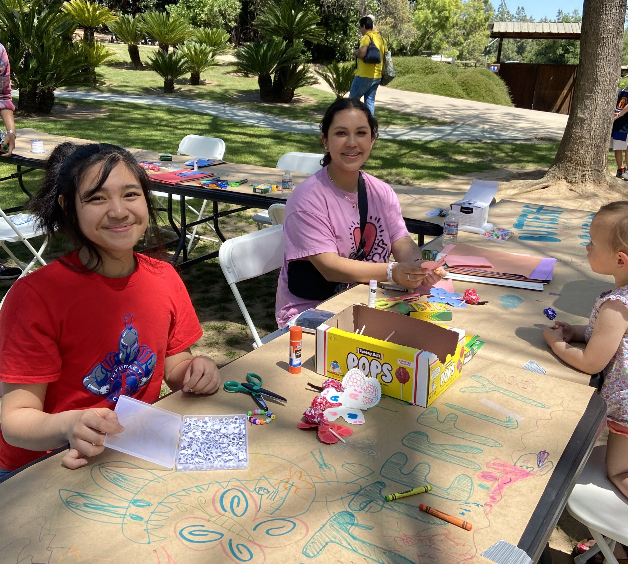 Shinzen Friendship Garden volunteers helping with kids crafts