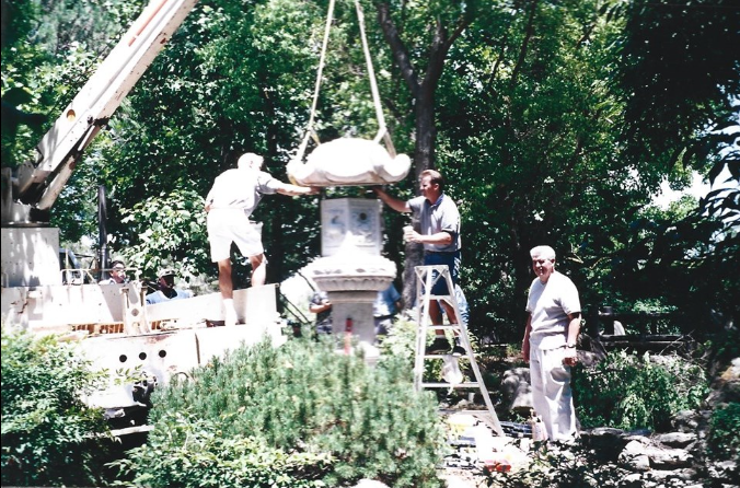 Rudy Castillo helping install the 1939 Lantern in the Shinzen Japanese Garden